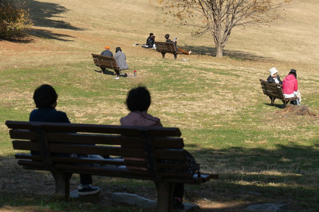 A Chilean family sharing a quiet moment on a park bench in a Santiago plaza