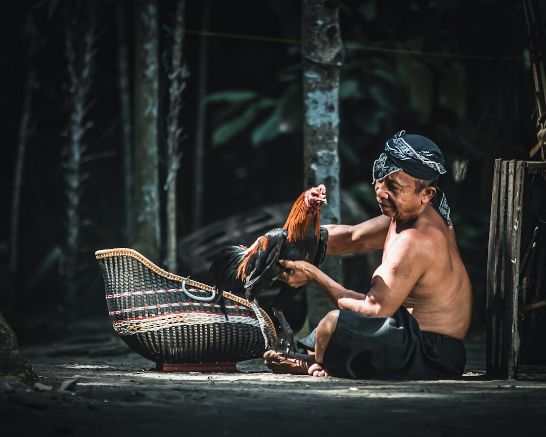 elderly man weaving basket