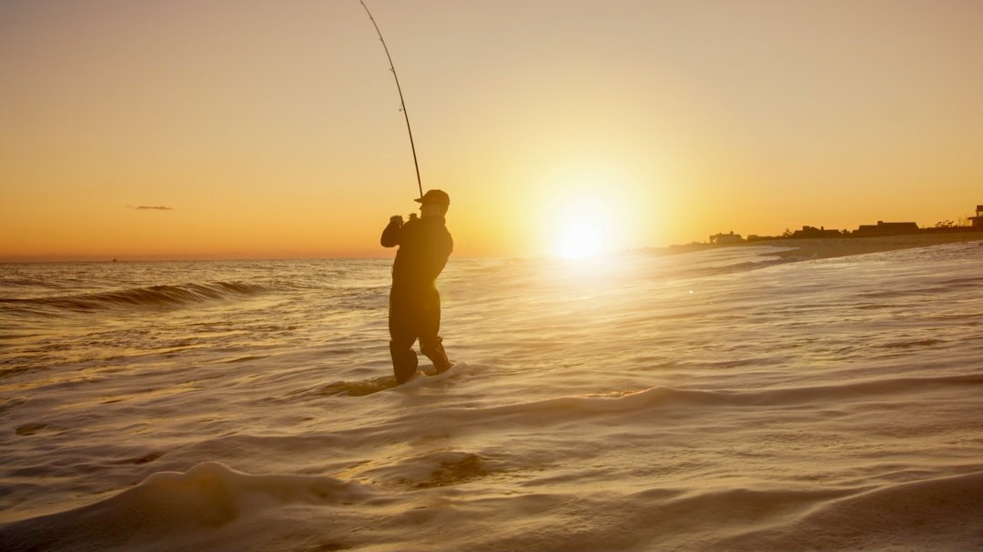 senior man fishing at dawn
