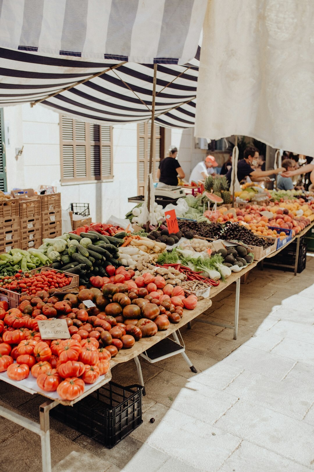 Crates of fresh produce stacked at a traditional Chilean market